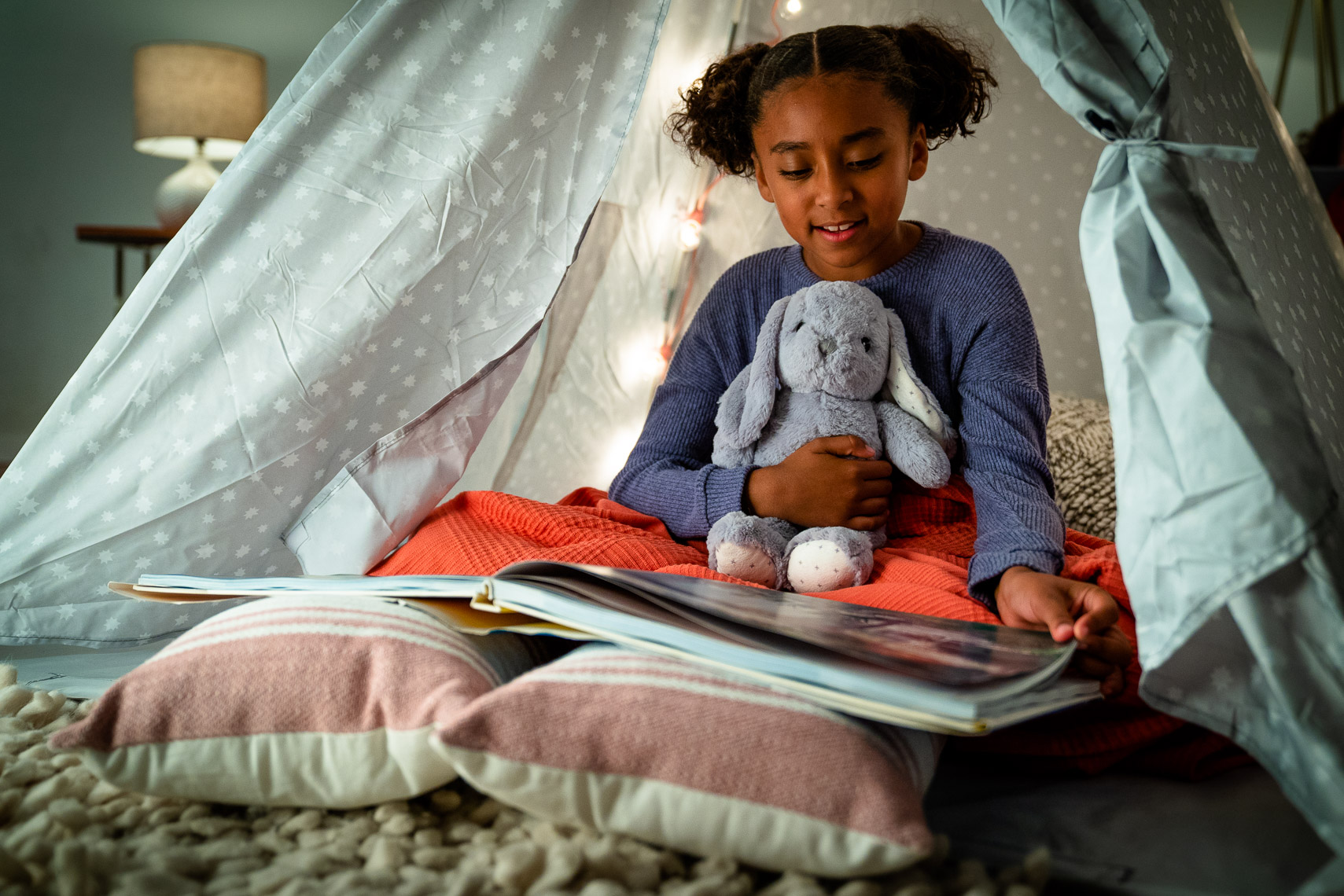 Avast - Young Girl Reading Book in Living Room Tent